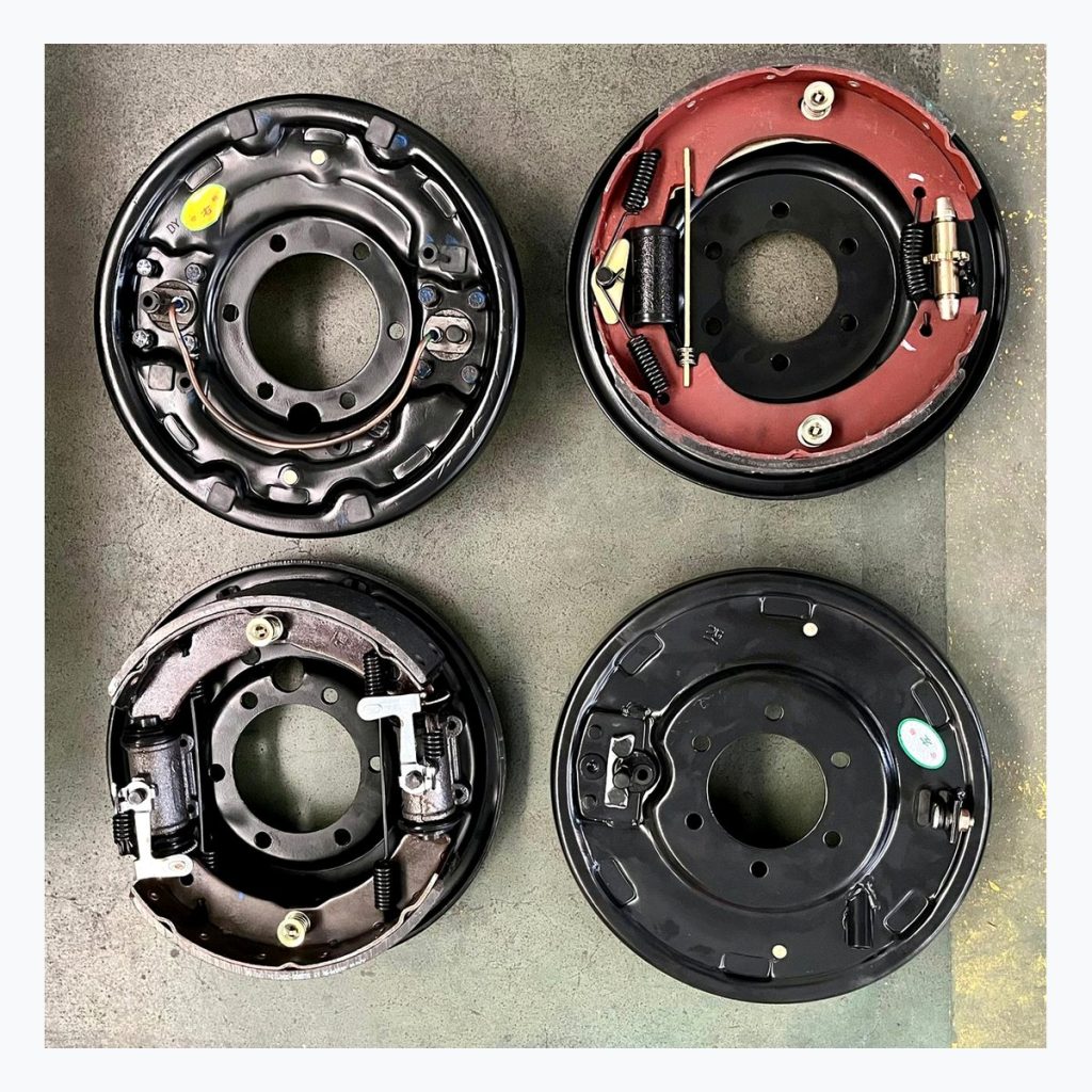 Multiple complete drum brake assemblies displayed for range comparison