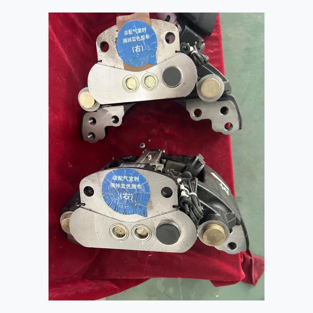 Complete brake shoe assemblies on red table