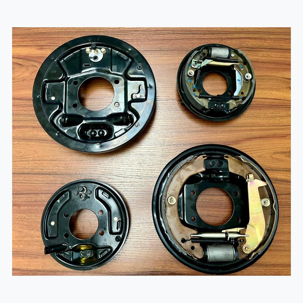 Four complete drum brake assemblies for product range comparison