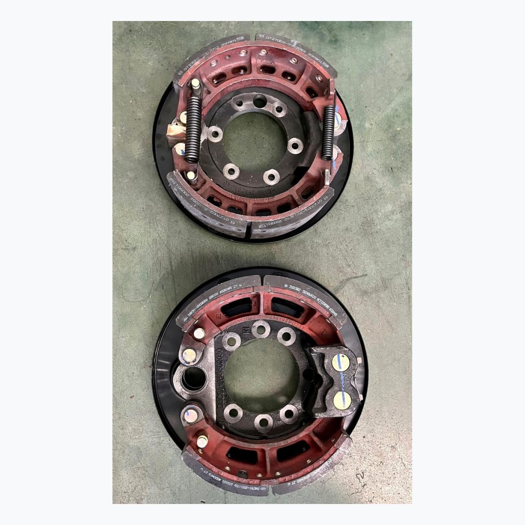 Paired complete brake shoe assemblies for range comparison